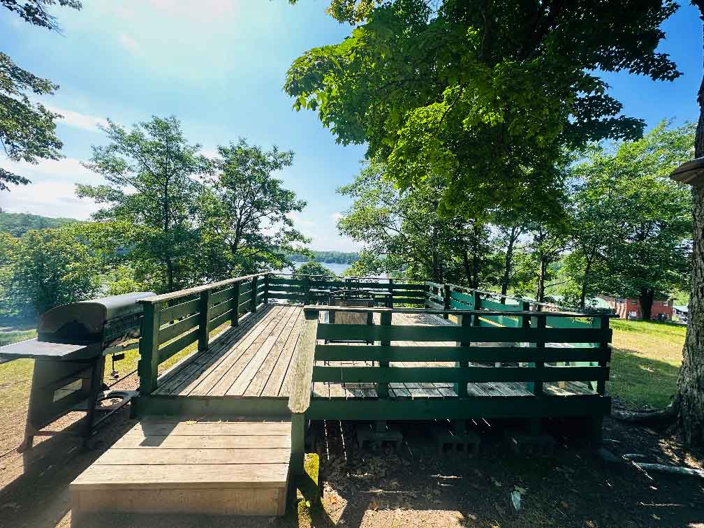 Flying Eagle’s own tree-shaded deck overlooking the water